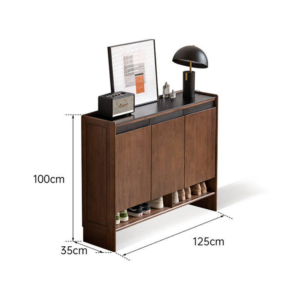 Limina natural solid walnut shoe cabinet with white ceramic top, adjustable internal shoe racks and open shoe storage shelves in a hallway