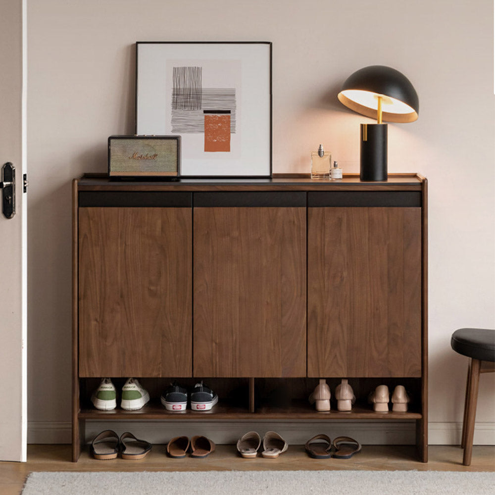 Limina natural solid walnut shoe cabinet with white ceramic top, adjustable internal shoe racks and open shoe storage shelves in a hallway