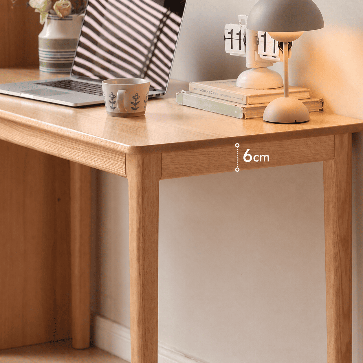 Scandinavian-style wooden desk with a spacious work surface and solid oak construction