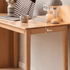 Scandinavian-style wooden desk with a spacious work surface and solid oak construction