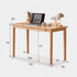 Natural oak computer desk with a minimalist design, sturdy solid wood legs, and a spacious work surface