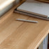 Medolla natural solid oak storage shelf with open shelving used as a bookshelf