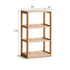 Medolla natural solid oak storage shelf with open shelving used as a bookshelf