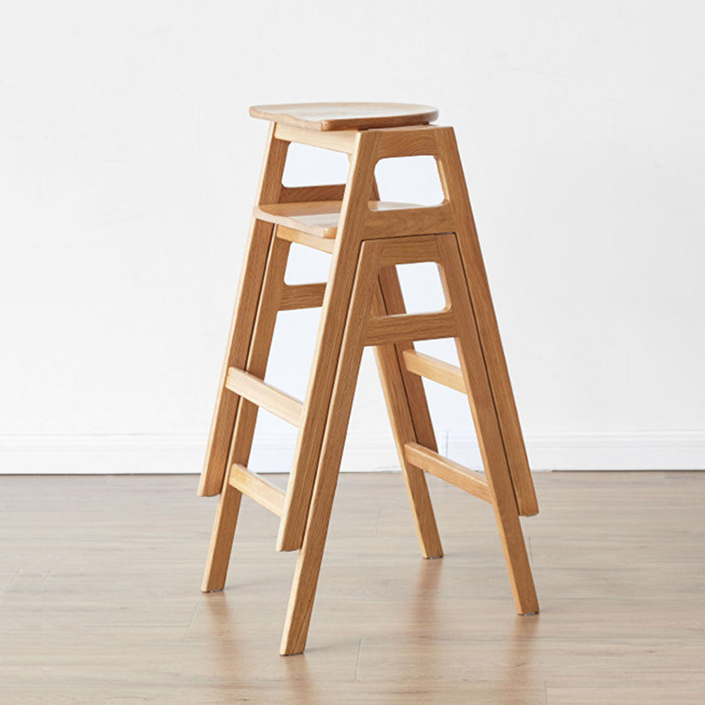 Mergo solid oak bar stool with stackable A-frame design and footrest, shown in natural oak finish with 69.5cm height.