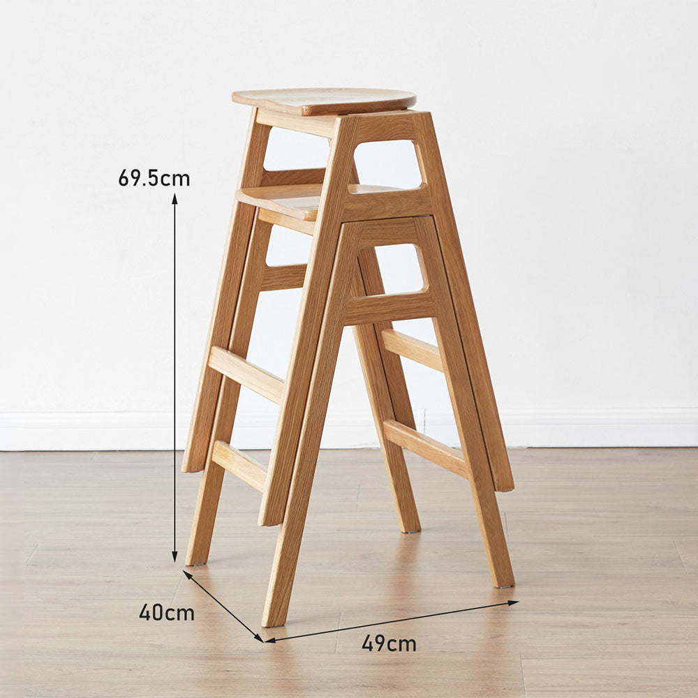 Mergo solid oak bar stool with stackable A-frame design and footrest, shown in natural oak finish with 69.5cm height.