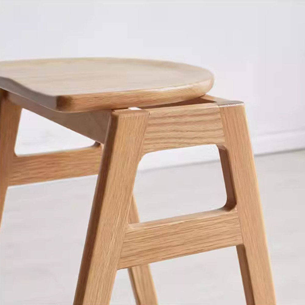 Mergo solid oak bar stool with stackable A-frame design and footrest, shown in natural oak finish with 69.5cm height.