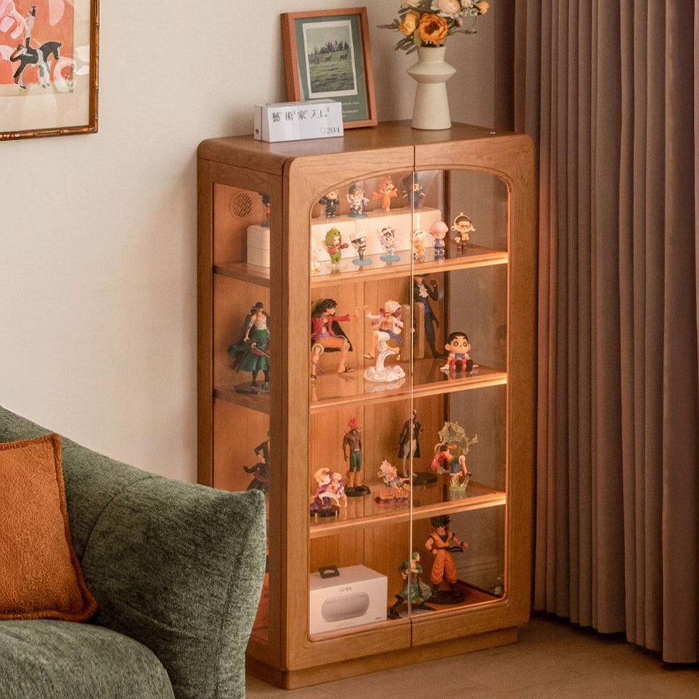 Milis natural solid cherry display cabinet with glass panels and LED lighting in a modern organic Kiwi living room