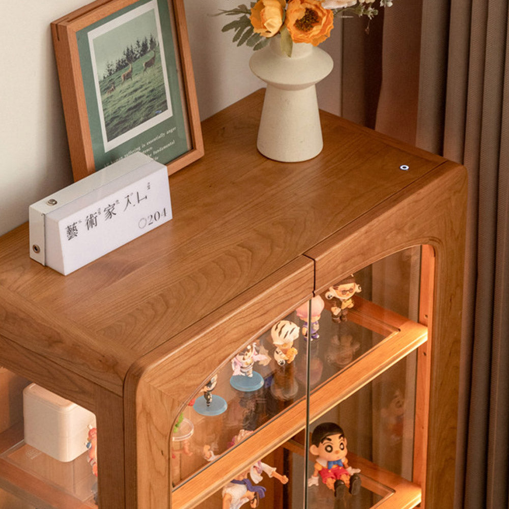 Milis natural solid cherry display cabinet with glass panels and LED lighting in a modern organic Kiwi living room