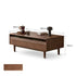 Modena natural solid walnut coffee table with glass-accented drawers and elevated legs in a modern living room setting