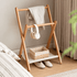 Naila natural beech folding coat rack with towel, headphones, basket and slippers