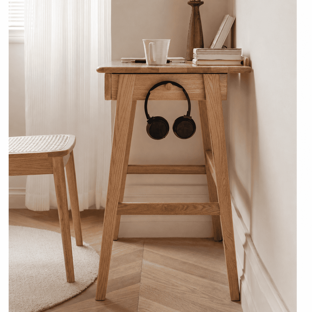 Solid oak side table with a built-in drawer and compact design for bedrooms or living spaces