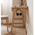 Solid oak side table with a built-in drawer and compact design for bedrooms or living spaces