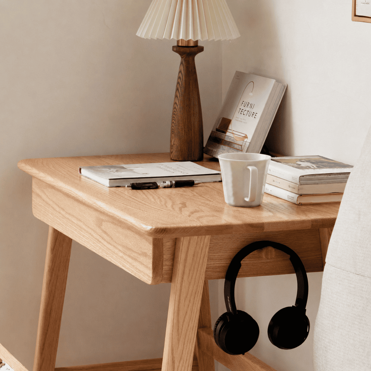 Modern oak bedside table featuring a storage drawer, open leg design, and natural wood finish