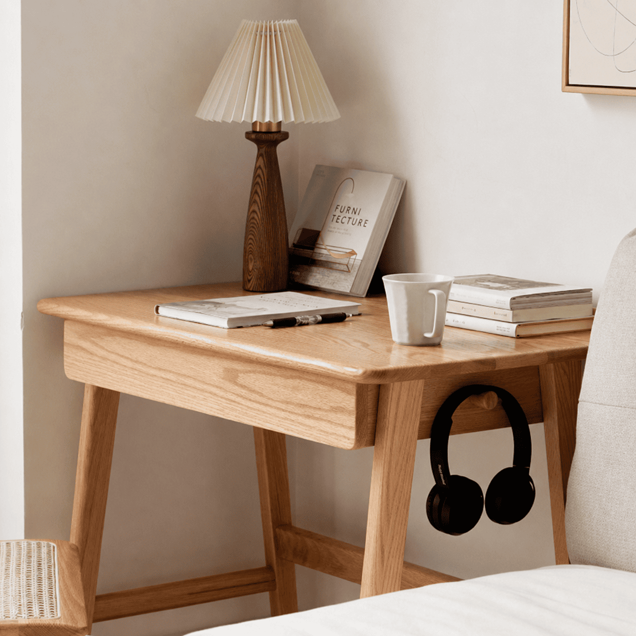 Scandinavian-style wooden side table with a single drawer and solid oak construction for versatile home use