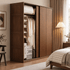 Neath solid oak wardrobe showing open hanging rail, shelves and storage boxes