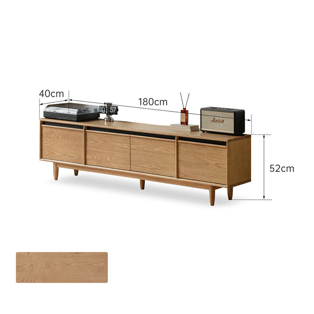 Aurin solid cherry floor standing entertainment unit with built-in LED display, glass sliding-door cabinet, two side drawers and a wide bottom drawer, styled under a wall-mounted TV.