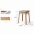 Natural oak nesting stool set with padded upholstered seats and a compact nesting design