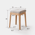 Contemporary oak nesting stools with fabric-cushioned seats, ideal for flexible seating and easy storage