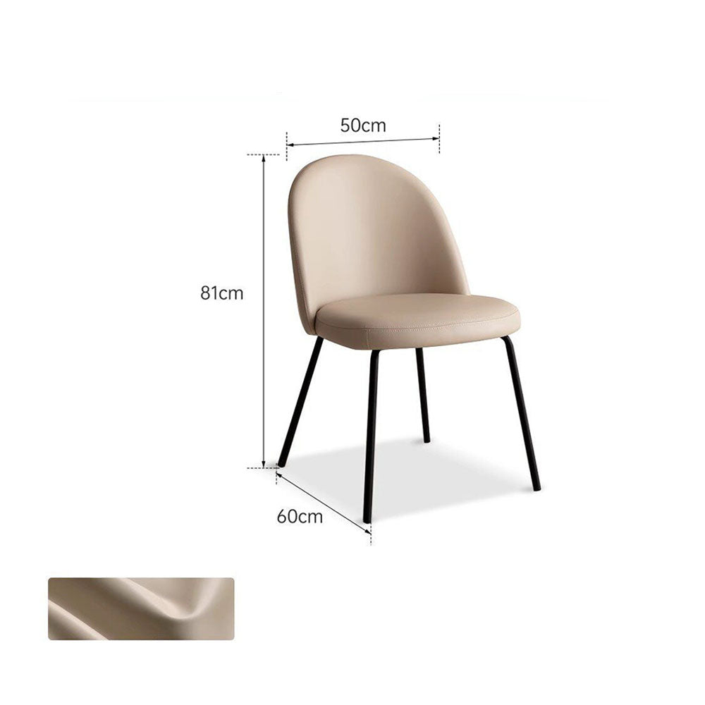 Loreto faux leather dining chair with curved backrest and matte black metal legs, shown in warm white/light brown upholstery.