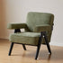 Polino faux shearling leisure sofa chair in green with warm-toned beech wood frame