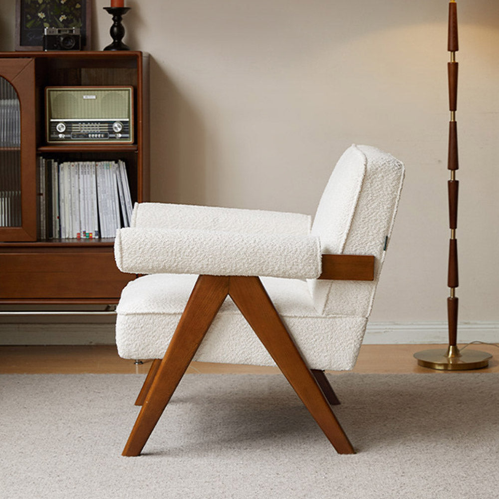 Polino faux shearling leisure sofa chair in white with warm-toned beech wood frame