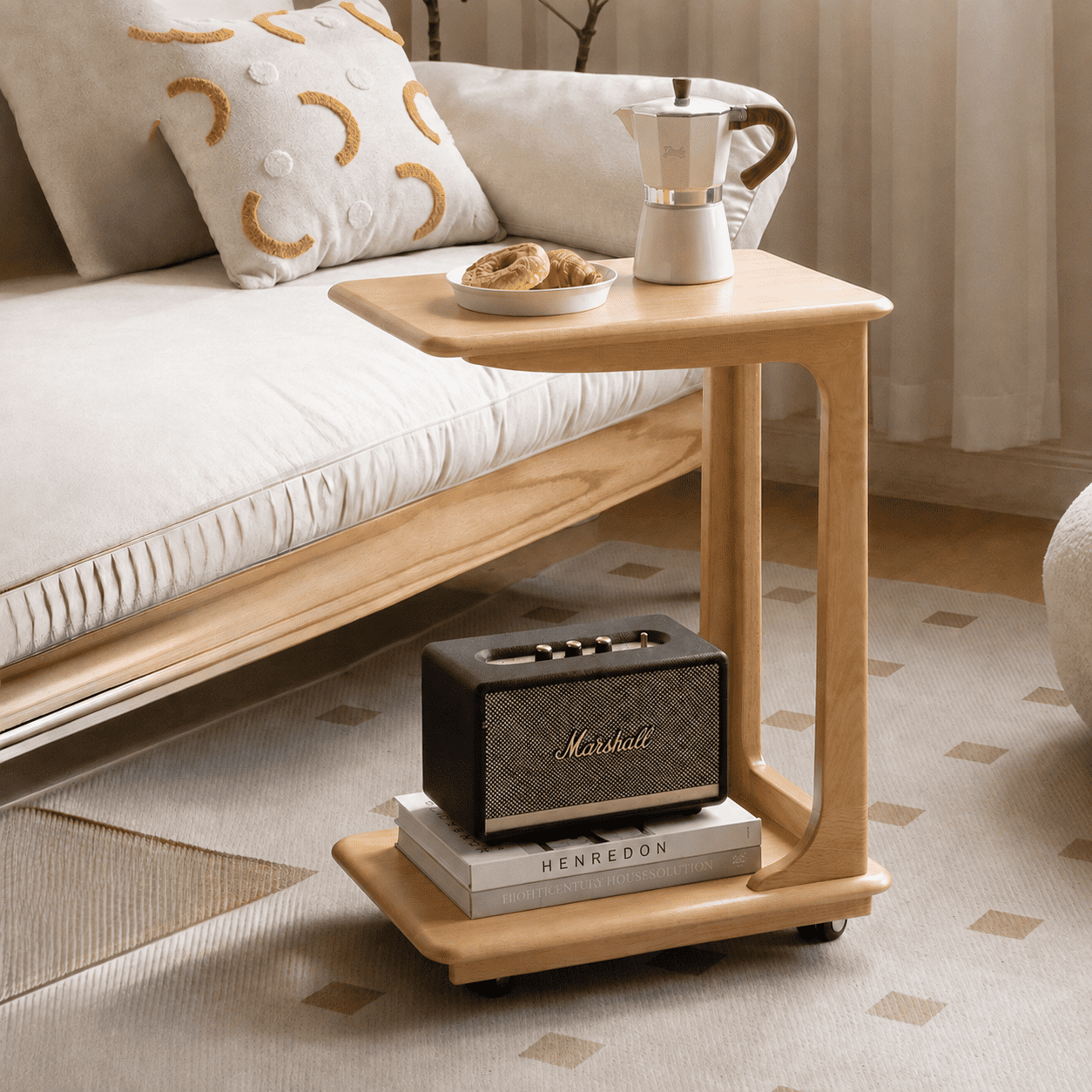 Scandinavian-style oak sofa side table with a lower shelf and smooth-rolling casters