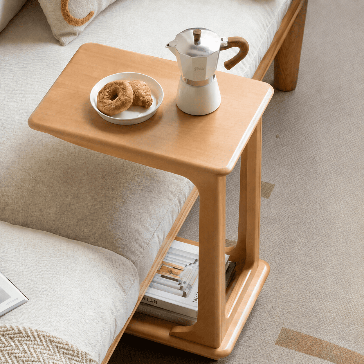 Contemporary rolling end table in a light oak finish with an integrated lower shelf