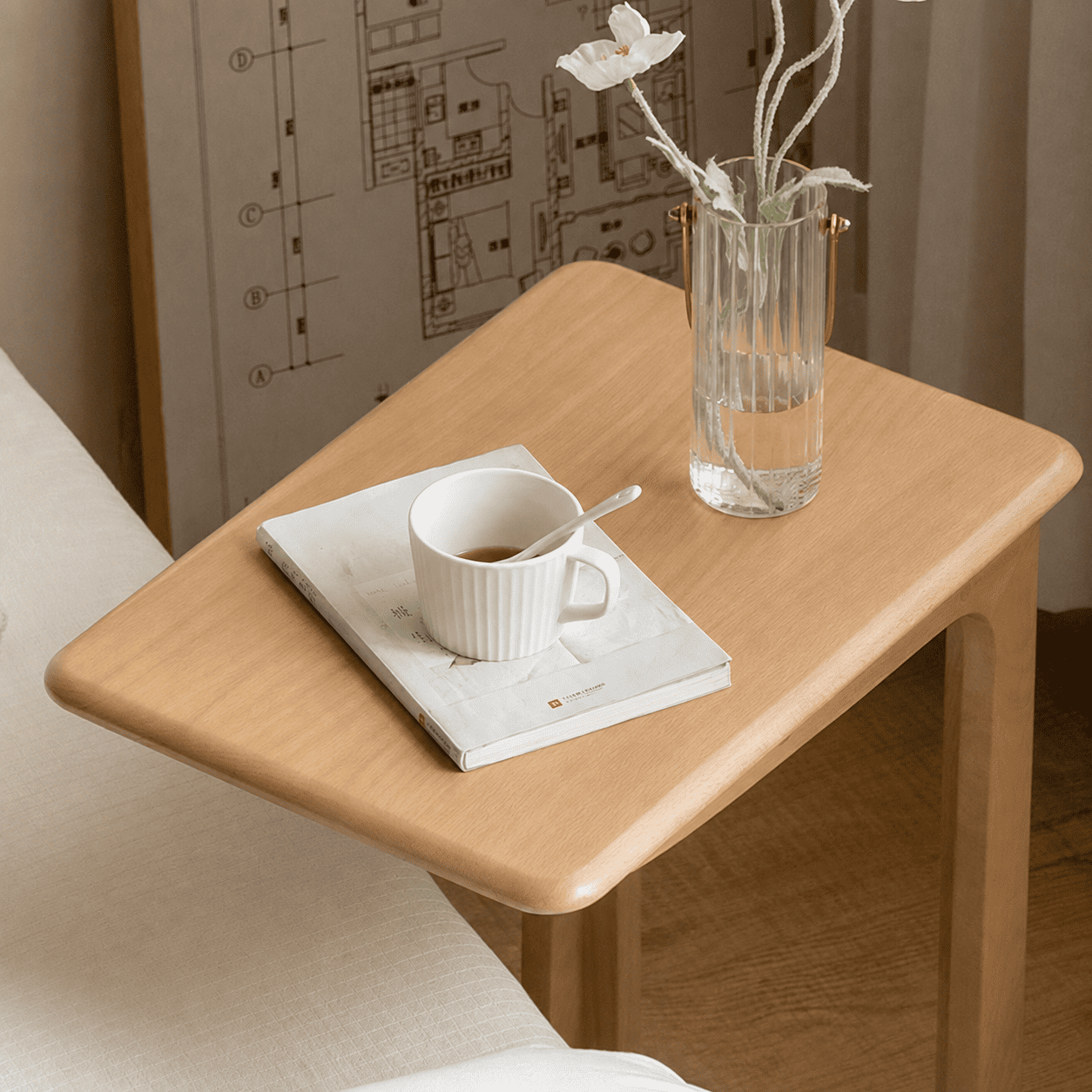 Compact wooden side table with wheels, open storage shelf, and minimalist design