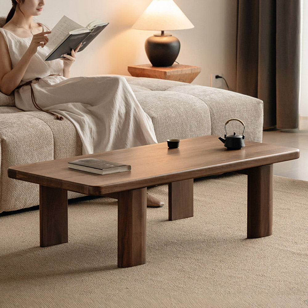 Ribera solid walnut Japandi coffee table with rounded edges and pillar legs