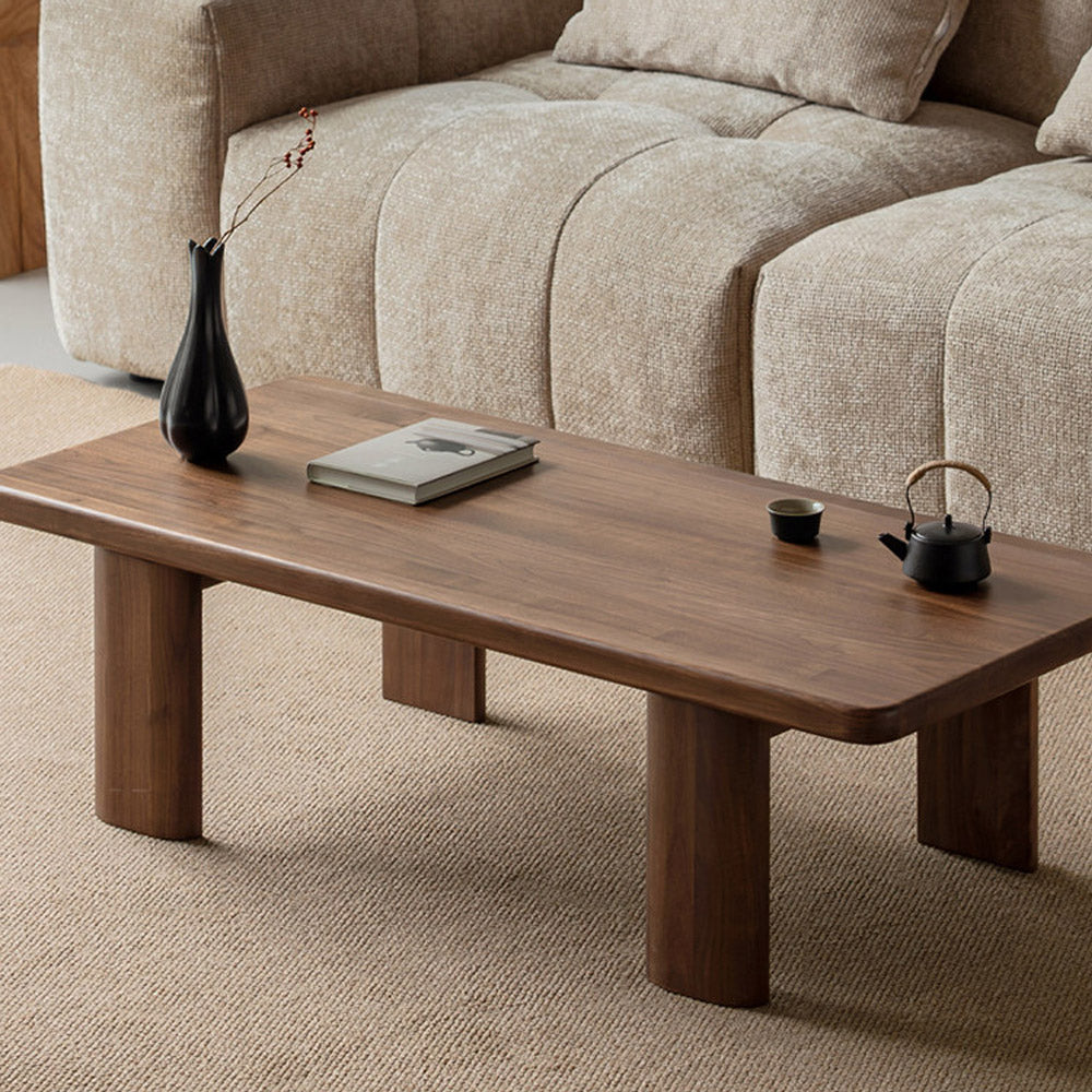 Ribera solid walnut Japandi coffee table with rounded edges and pillar legs