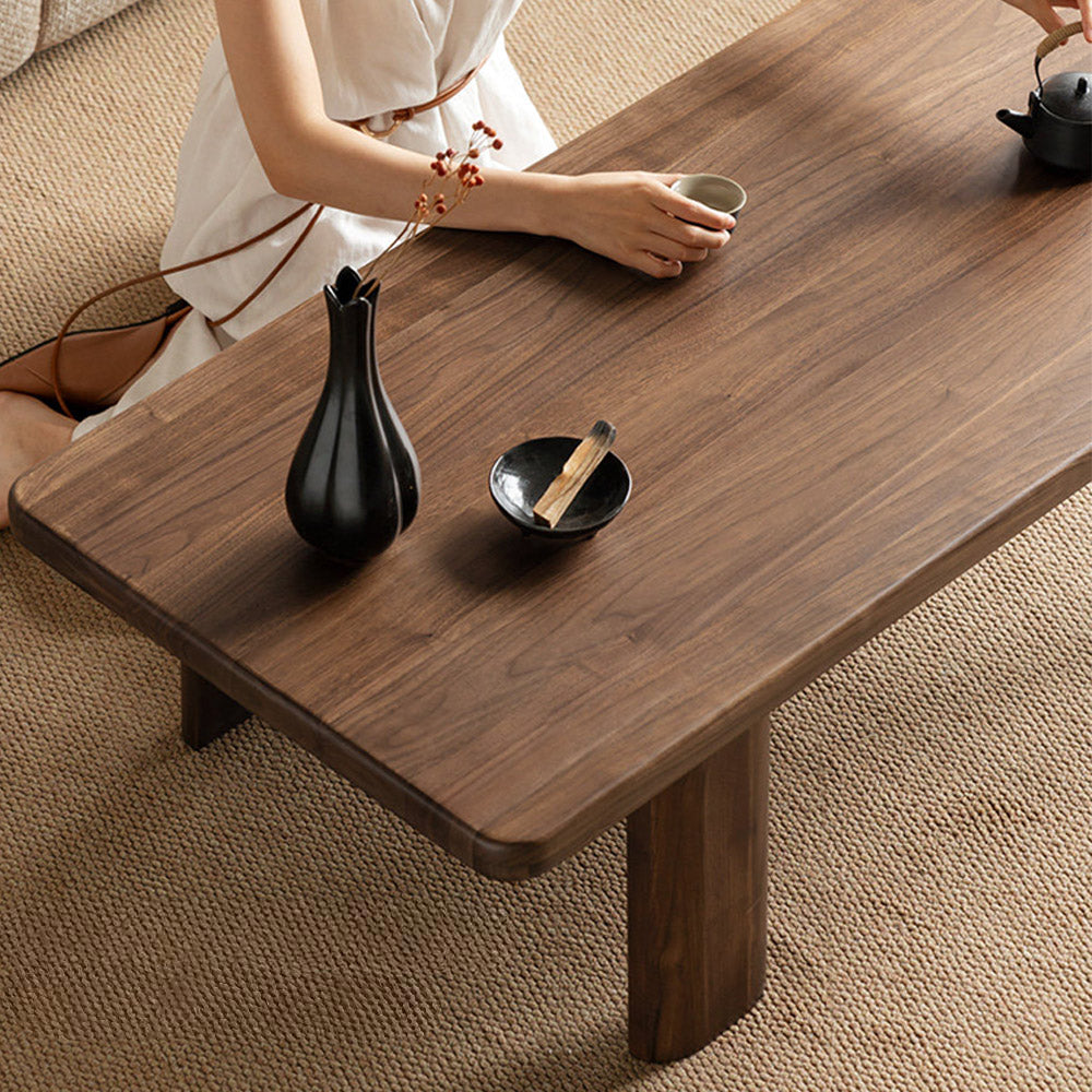 Ribera solid walnut Japandi coffee table with rounded edges and pillar legs