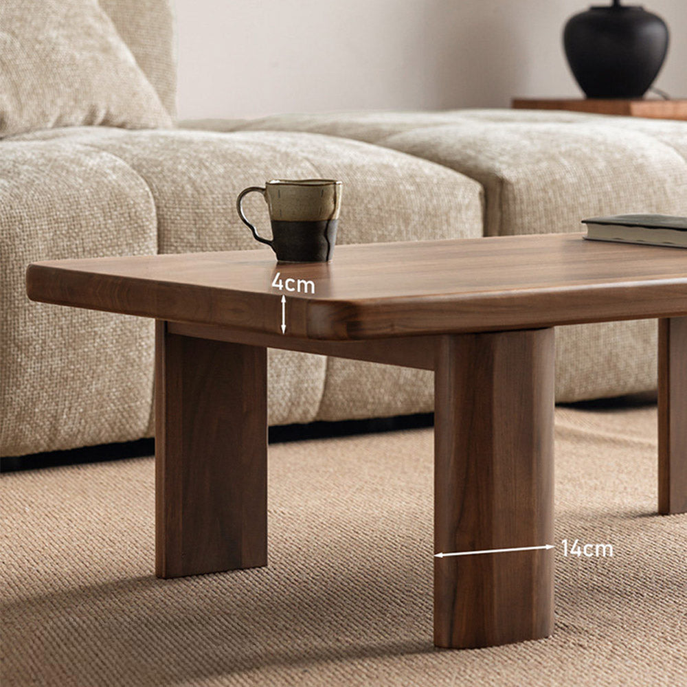 Ribera solid walnut Japandi coffee table with rounded edges and pillar legs