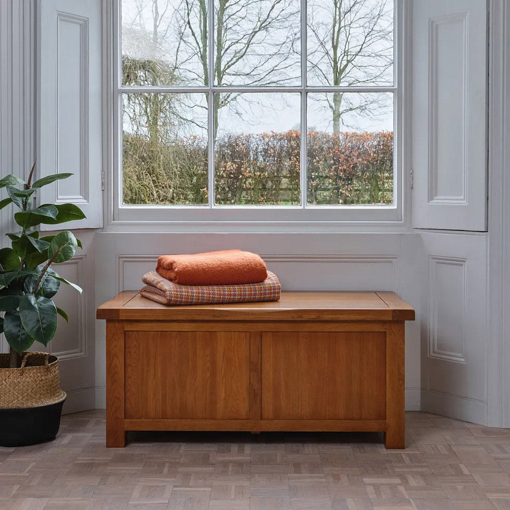 Rustic solid oak blanket box with soft-close lid and classic wax finish for bedroom storage