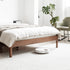 Seattle solid oak platform bed frame styled in a bright modern Kiwi bedroom