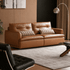Tacoma brown genuine leather sofa in modern living room with warm wood wall panels