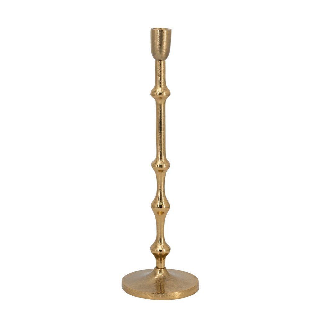 Gold taper candle holder with slim sculptural stem for elegant candle display