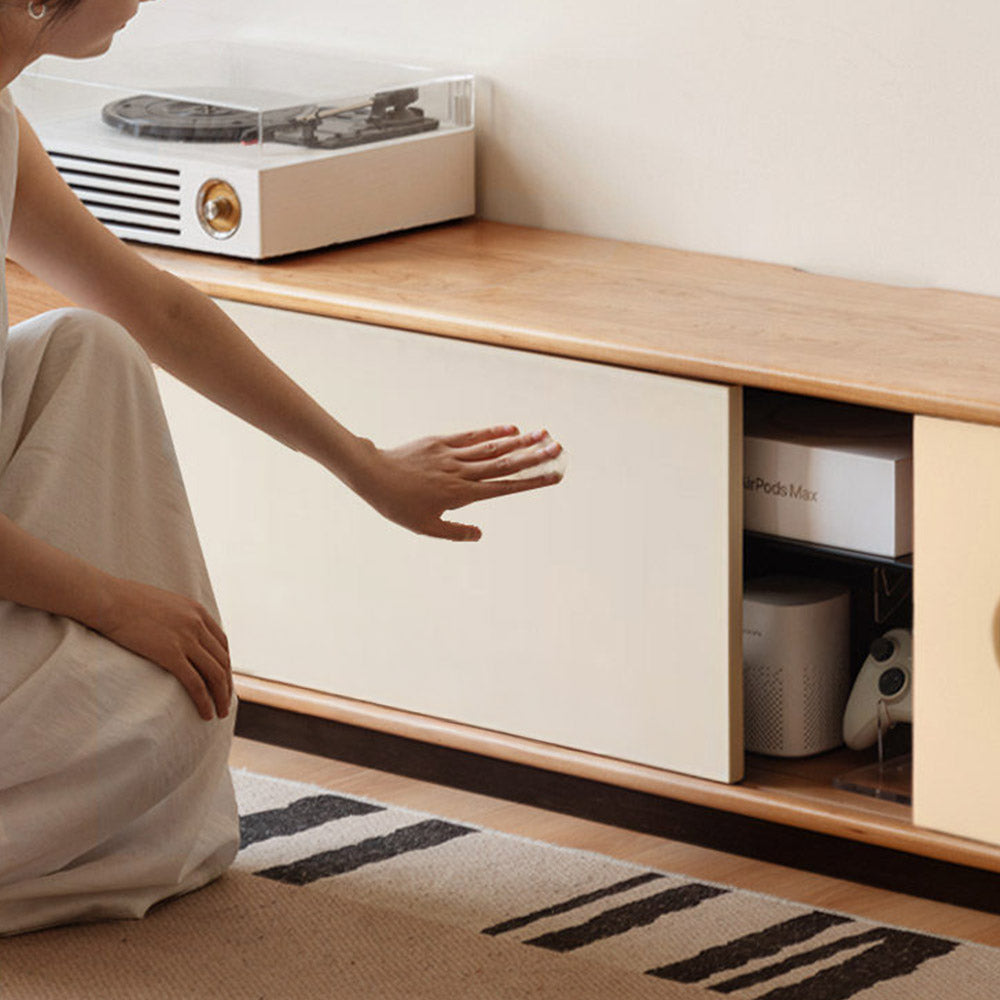 Tonnac solid cherry entertainment unit with drawers, glass shelving and modern retro design in a Kiwi living room