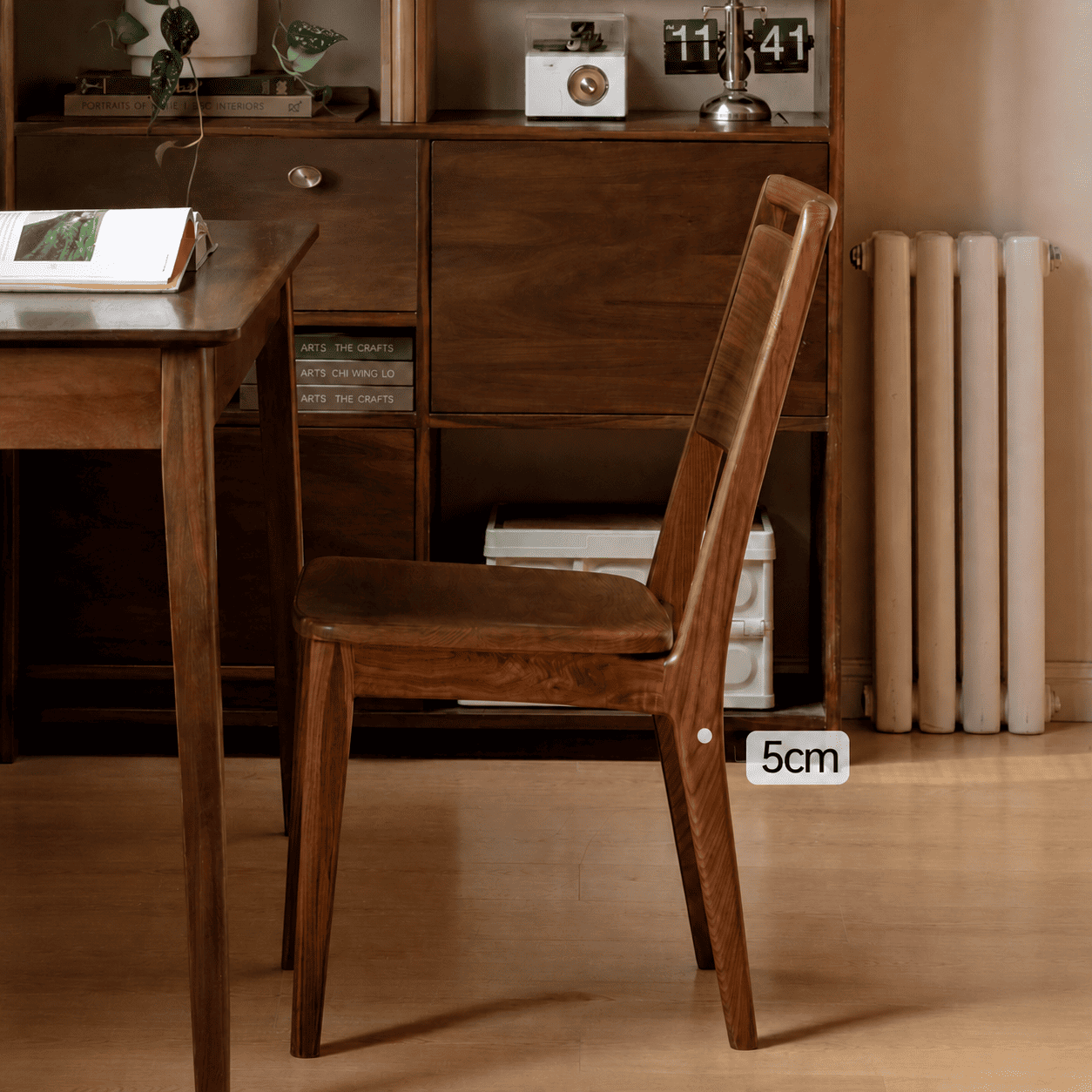 Solid walnut dining chair with smooth rounded seat for modern dining room styling