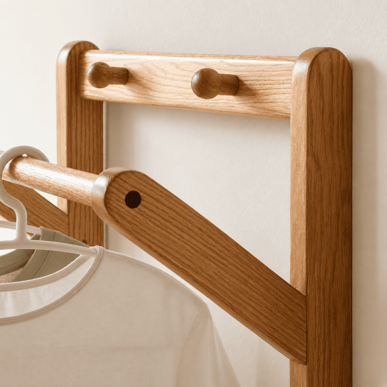 Warburg solid oak coat rack with drawer, hanging rail and mirror styled in a bright bedroom corner