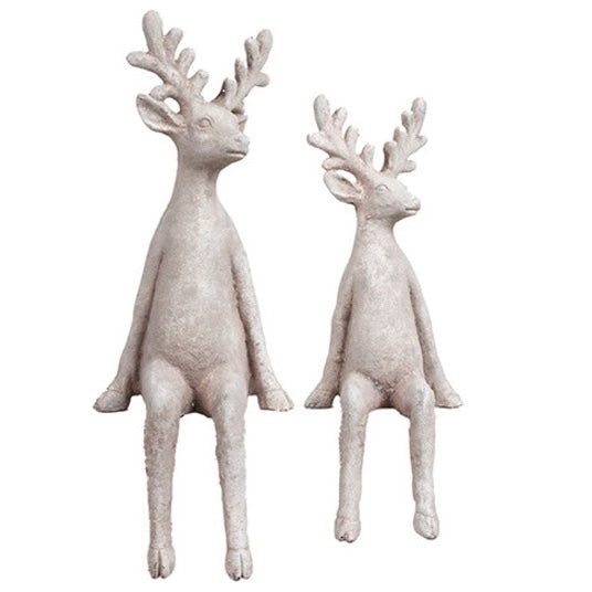 Set of two seated Christmas reindeer ornaments in pebble grey finish with textured antlers and dangling legs