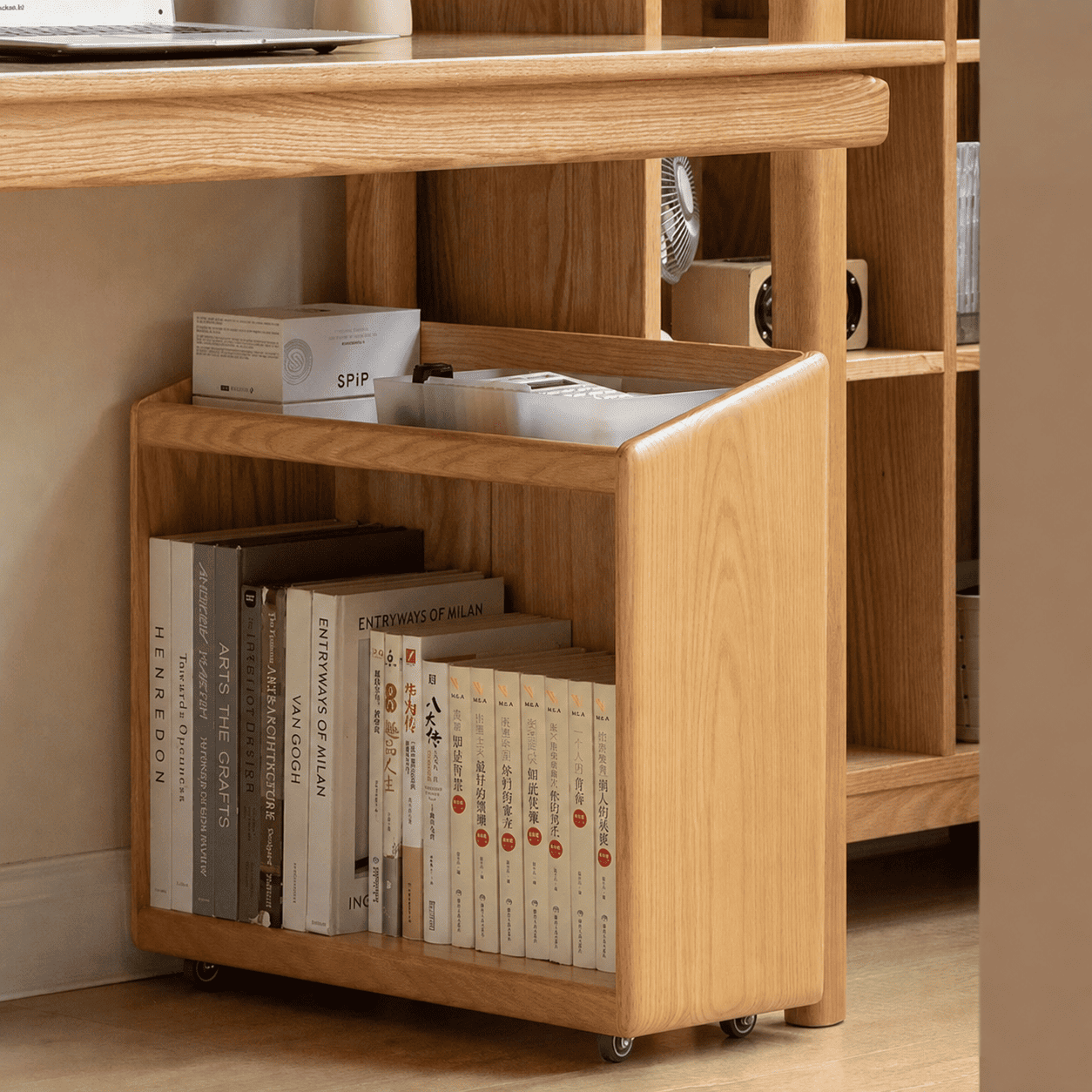 Rolling oak storage cabinet with open shelving for books, magazines, and everyday essentials