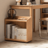 Mobile wooden storage unit with open shelves and caster wheels for flexible home organisation