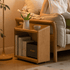 Light oak rolling bookshelf featuring open storage for books and household accessories