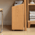 Space-saving oak storage cart with open shelving and wheels for easy movement around the home