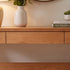 Natural solid oak console table paired with round wall mirror for stylish hallway décor