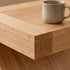 Natural solid oak side table for holding lamps, books, drinks, and everyday living room essentials