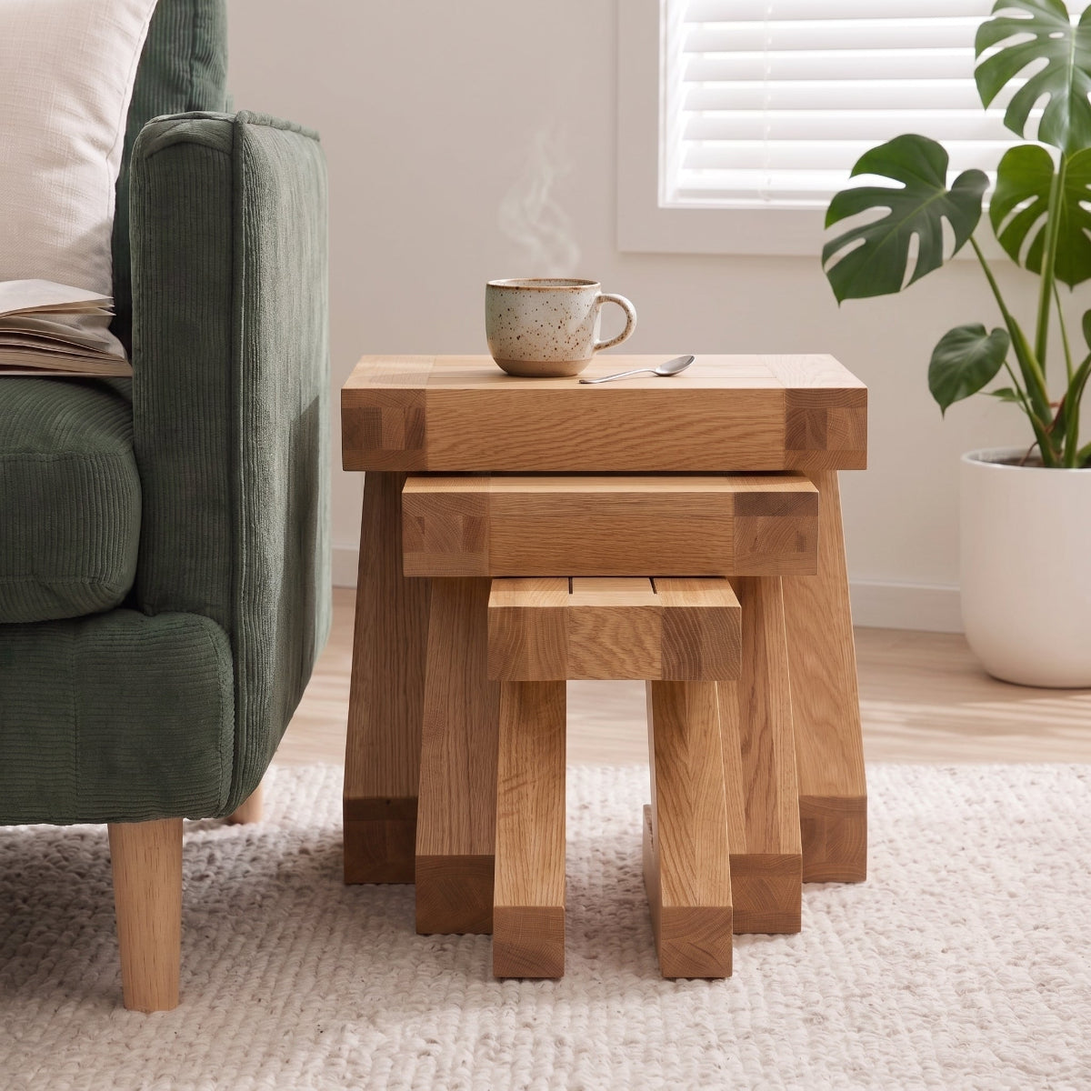 Solid oak nest of tables with natural wood grain for compact living room furniture