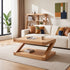 Natural solid oak lounge table styled with coffee mug, books, and soft neutral décor