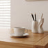 Large solid oak desk with warm natural finish for study, work, and creative spaces